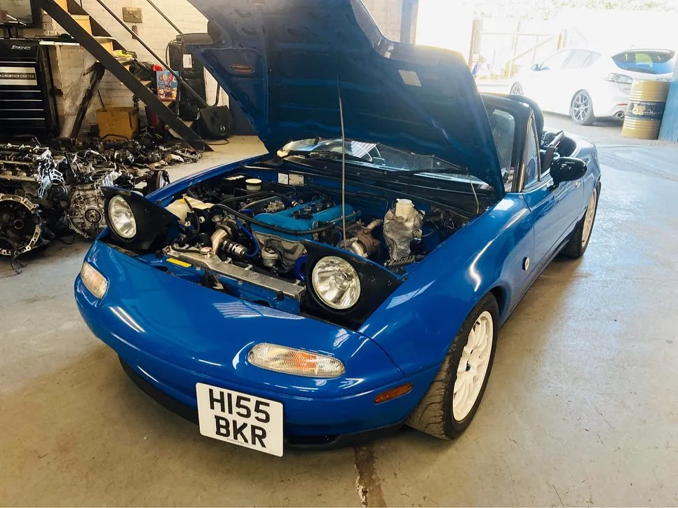 Blue Mazda MX-5 with the bonnet open at CJ Performance Mansfield