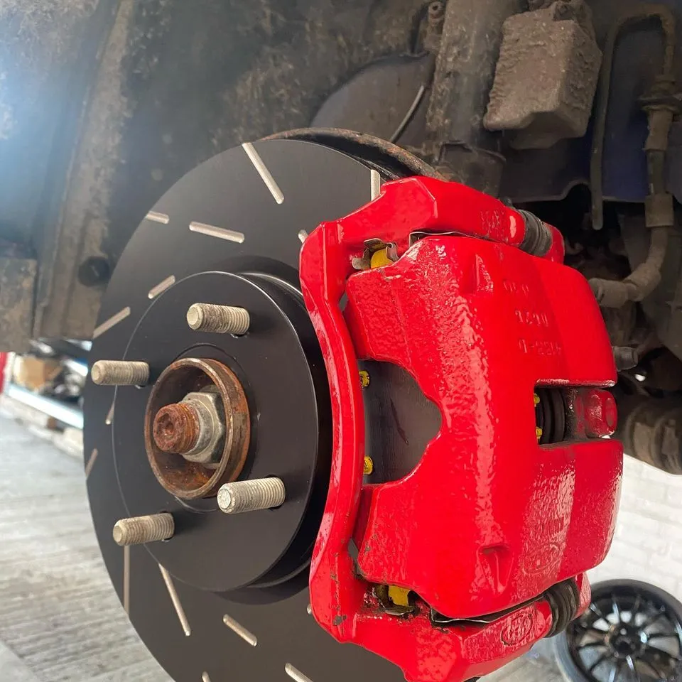 Red brake caliper and grooved disc fitted by CJ Performance Mansfield