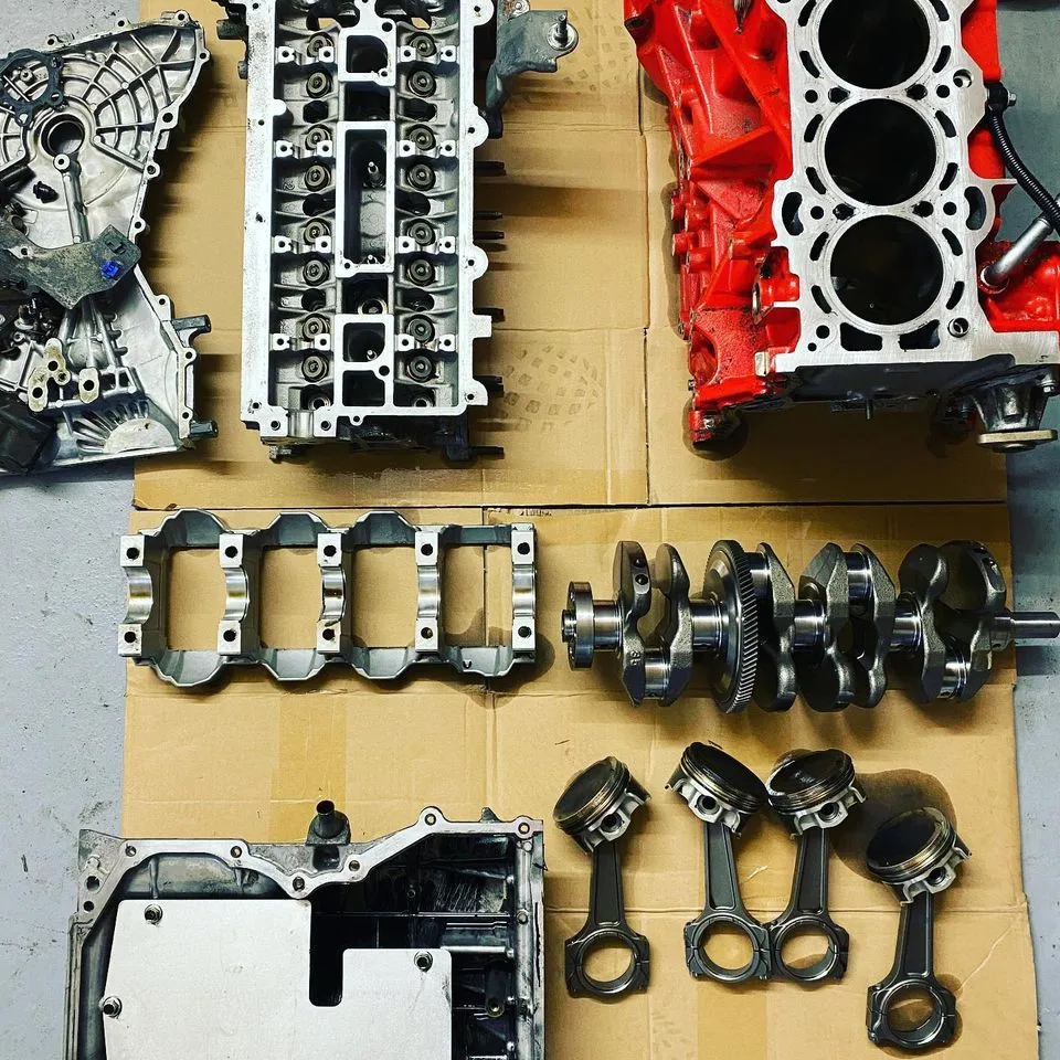 Engine parts laid out for a rebuild at CJ Performance Mansfield