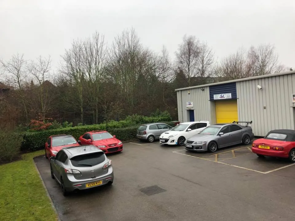 Customer cars parked outside the CJ Performance workshop in Mansfield