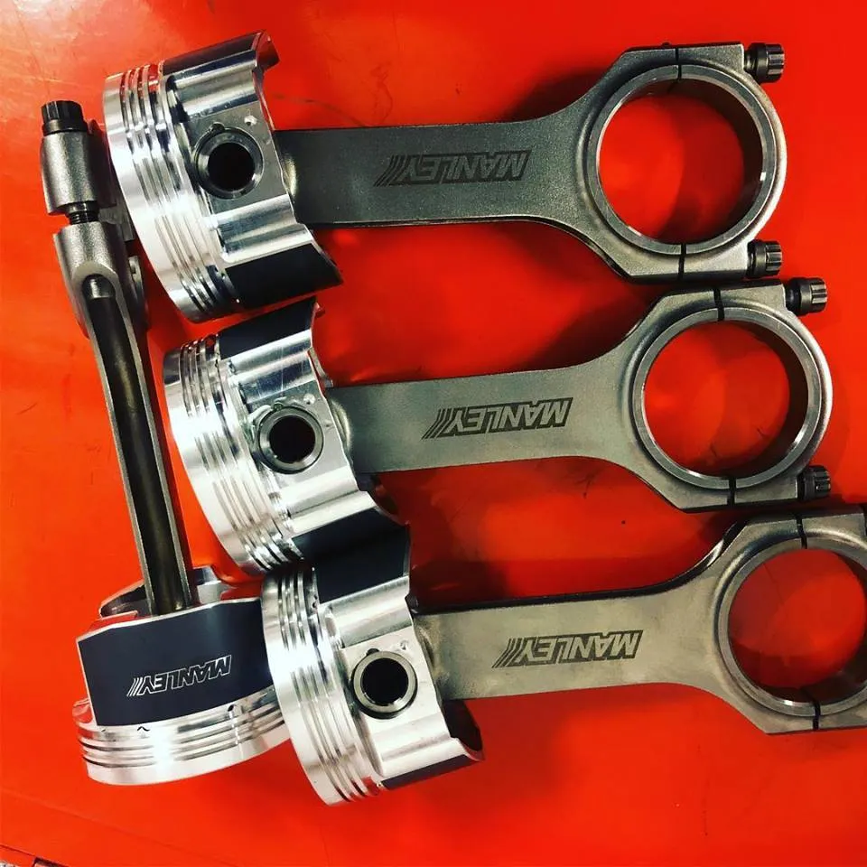 Forged pistons and rods ready for an engine build at CJ Performance Mansfield